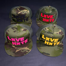 Load image into Gallery viewer, Camo LXVE over HXTE Trucker Hat
